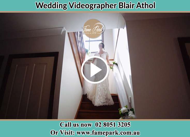 Bride walking down the staircase Blair Athol NSW 2560