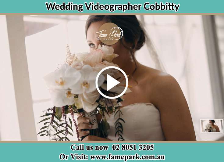 Bride smelling a bouquet of flowers near the window Cobbitty NSW 2570