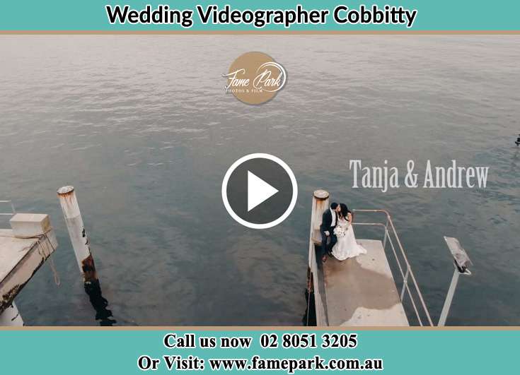 Bride and Groom kissed while sitting at the bay walk Cobbitty NSW 2570