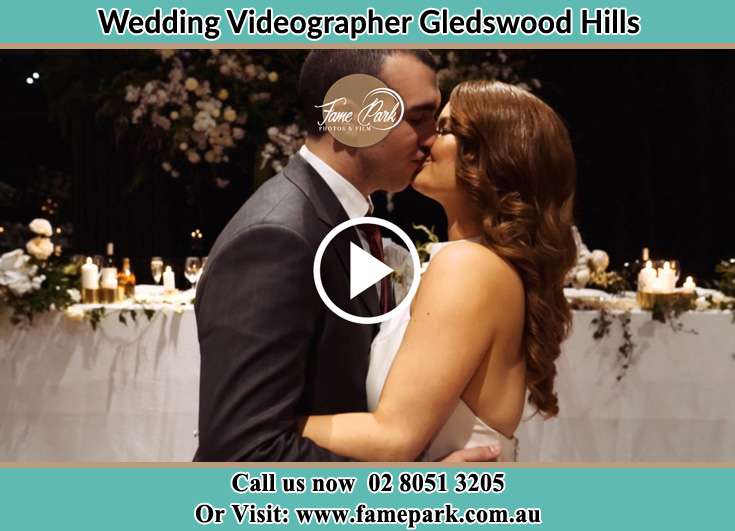 The newlyweds kissing Gledswood Hills NSW 2557