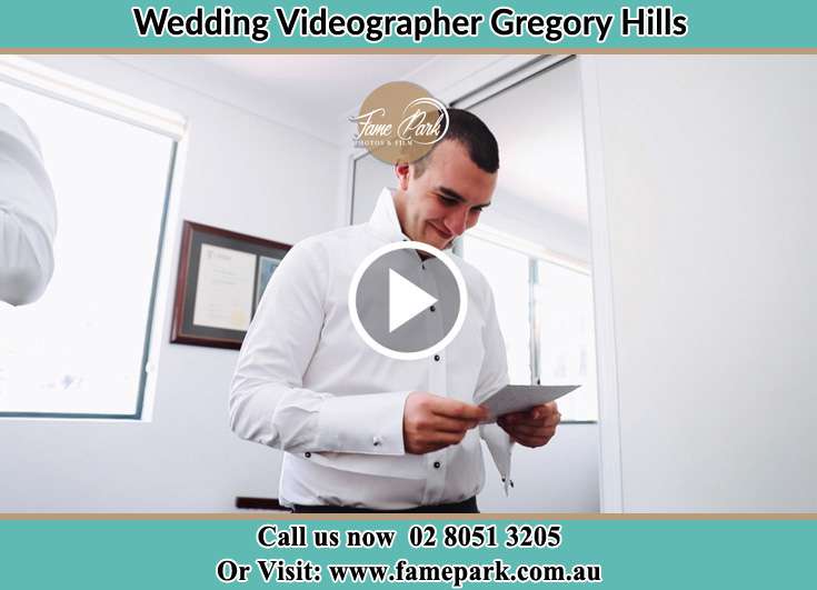 The Groom reading a note Gregory Hills NSW 2557