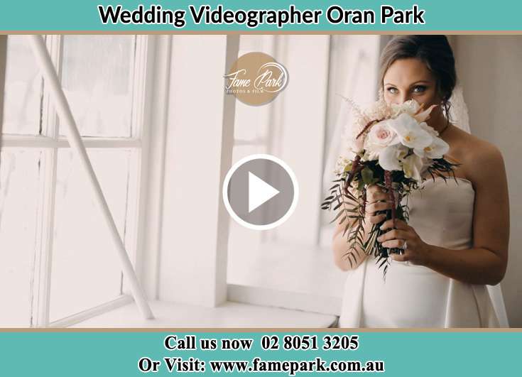 The Bride smells a bouquet of flowers Oran Park NSW 2570